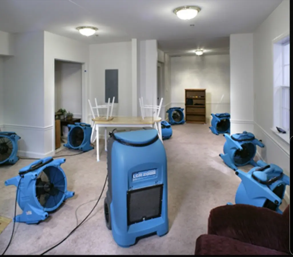 Air movers and dehumidifier setup for Water Damage Restoration in Georges